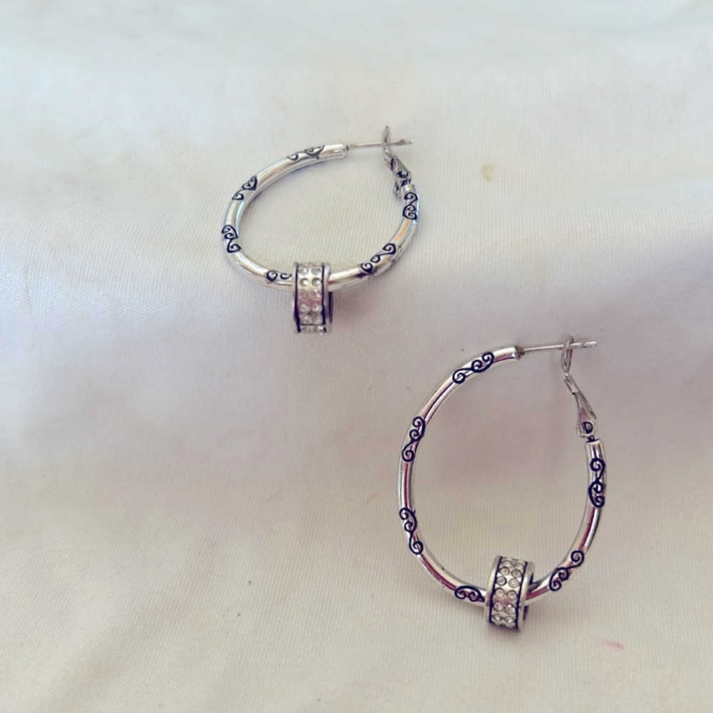 Brighton hoop earrings with a dangling charm